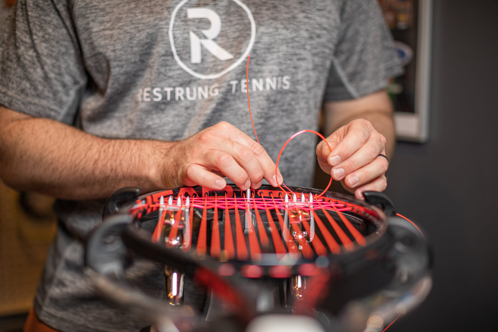 Racquet stringing in progress